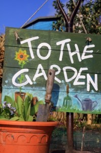 To The Garden Sign With Pot by Simon Howden